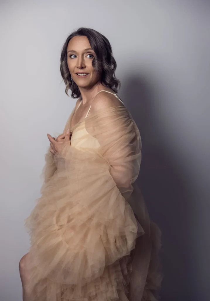 Portrait of Julie Ann White in a flowing neutral dress