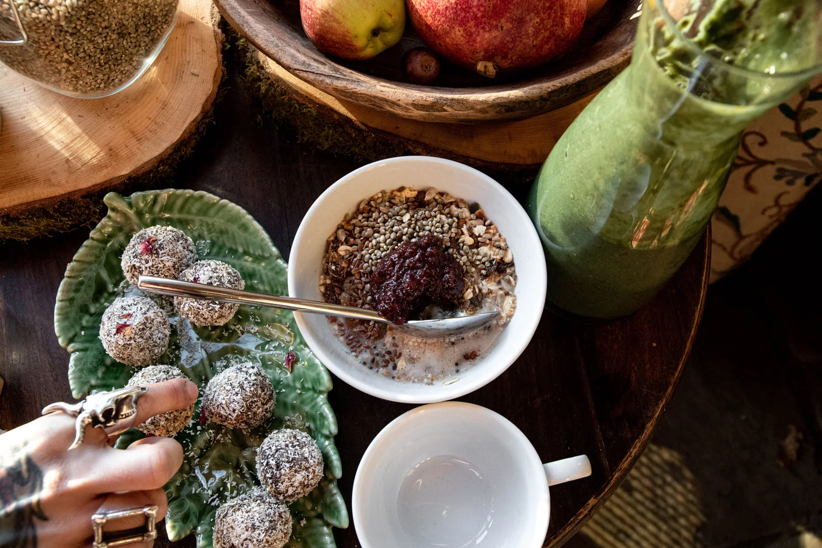 Healthy retreat breakfast with fruit, granola, energy bites and green juice
